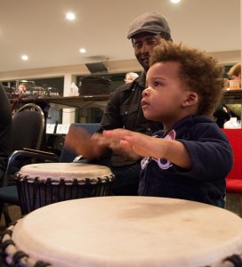 Dad and child at the drumming circle