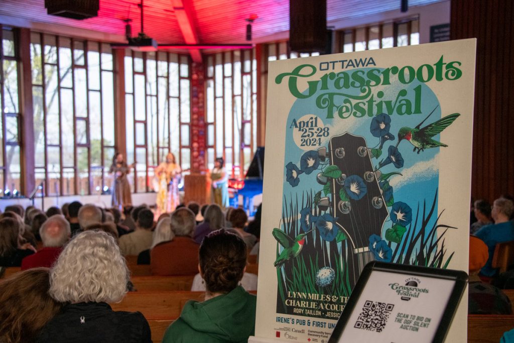 Jessica Pearson and her band are out of focus in the background, and a beautiful festival poster by Ottawa's Marc Audet in the foreground.  Copies of this are still available!